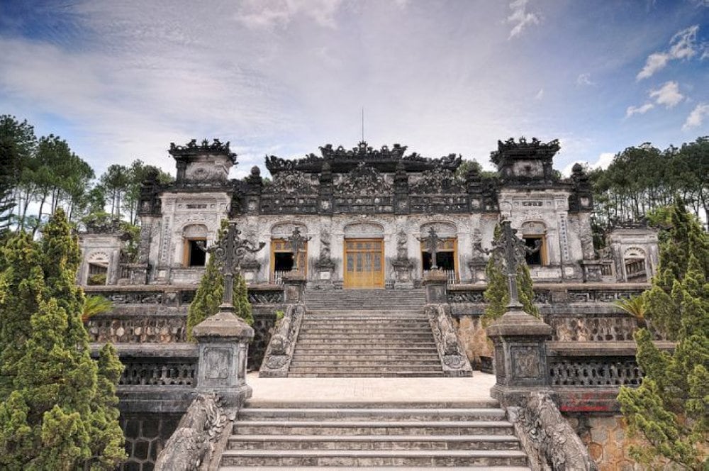 The tomb is built into a steep hillside and is composed of several levels